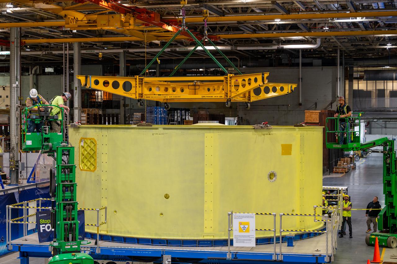 Crews at NASA’s Michoud Assembly Facility in New Orleans move the forward skirt of NASA’s Space Launch System (SLS) rocket to another part of the facility Dec. 15. Teams are preparing to apply the thermal protection system to the flight hardware, which will protect it from the extreme temperatures during launch and flight. The forward skirt is part of the core stage that will power the SLS rocket for the Artemis III mission. The forward skirt houses flight computers, cameras, and avionics.. The SLS core stage is made up of five unique elements: the forward skirt, liquid oxygen tank, intertank, liquid hydrogen tank, and the engine section. When fully stacked, the forward skirt is located at the top of the core stage and connects the stage to the upper part of the rocket. Together with its four RS-25 engines, the rocket’s massive 212-foot-tall core stage — the largest stage NASA has ever built — and its twin solid rocket boosters produce 8.8 million pounds of thrust to send NASA’s Orion spacecraft, astronauts and supplies beyond Earth’s orbit to the Moon and, ultimately, Mars. Offering more payload mass, volume capability and energy to speed missions through space, the SLS rocket, along with NASA’s Gateway in lunar orbit, the Human Landing System, and Orion spacecraft, is part of NASA’s backbone for deep space exploration and the Artemis lunar program. No other rocket is capable of carrying astronauts in Orion around the Moon in a single mission.